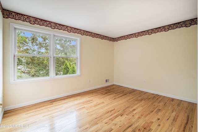 146 Inskip Ave, Ocean Grove, NJ 07756 - empty room with plenty of natural light, wood finished floors, and baseboards