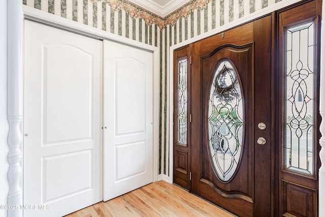 146 Inskip Ave, Ocean Grove, NJ 07756 - entryway with light wood-type flooring, wallpapered walls, and crown molding