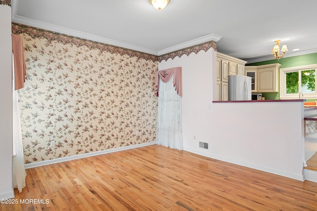 146 Inskip Ave, Ocean Grove, NJ 07756 - unfurnished room featuring light wood finished floors, crown molding, baseboards, and a chandelier