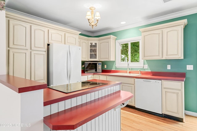 146 Inskip Ave, Ocean Grove, NJ 07756 - kitchen featuring white appliances, cream cabinets, a sink, light wood finished floors, and ornamental molding
