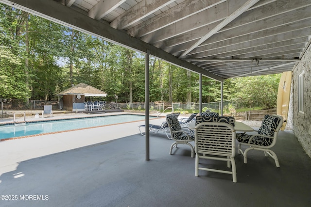 2123 Baileys Corner Rd, Wall, NJ 07719 - fenced backyard featuring a patio, view of scattered trees, and an outbuilding