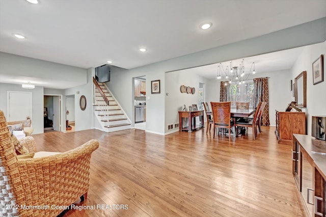 66 Cold Indian Springs Rd, Ocean Twp, NJ 07712 - living room with stairway, light wood finished floors, recessed lighting, a chandelier, and baseboards