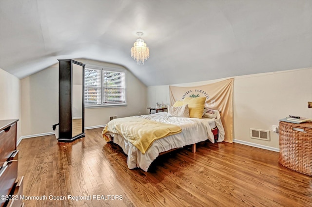 66 Cold Indian Springs Rd, Ocean Twp, NJ 07712 - bedroom with wood finished floors, vaulted ceiling, baseboards, and a chandelier