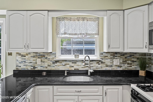 15 Peachstone Rd, Howell, NJ 07731 - kitchen with a sink, white cabinetry, tasteful backsplash, and dark stone counters
