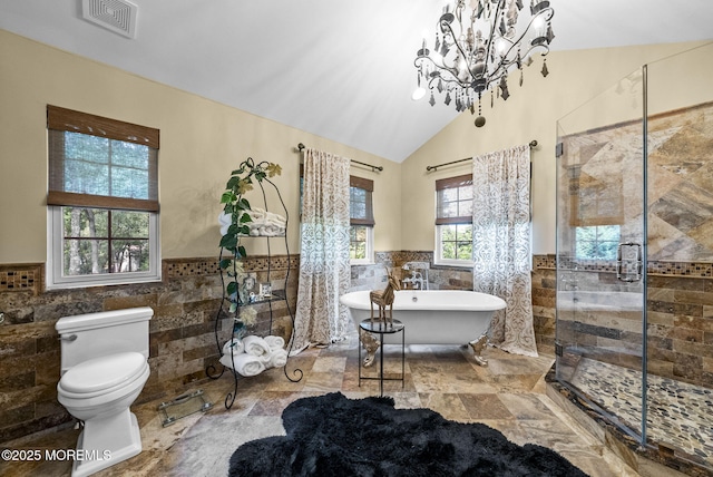 12 Conor Rd, Jackson, NJ 08527 - full bath featuring tile walls, wainscoting, a freestanding bath, a shower stall, and toilet