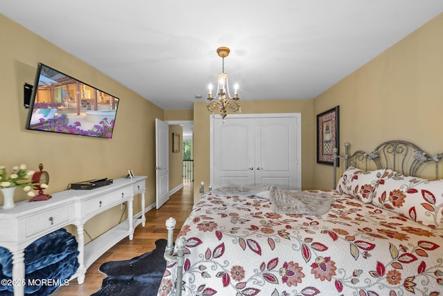 12 Conor Rd, Jackson, NJ 08527 - bedroom with a chandelier, wood finished floors, a closet, and baseboards