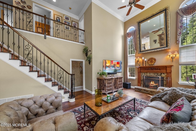 12 Conor Rd, Jackson, NJ 08527 - living room with wood finished floors, a high ceiling, crown molding, baseboards, and stairs