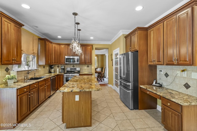 12 Conor Rd, Jackson, NJ 08527 - kitchen with stainless steel appliances, a sink, a kitchen island, decorative backsplash, and brown cabinetry