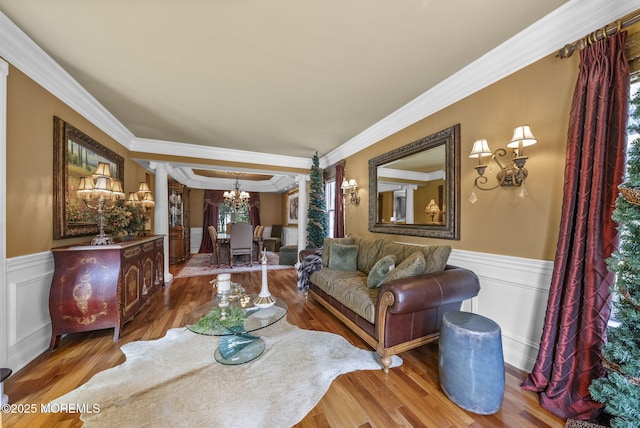 12 Conor Rd, Jackson, NJ 08527 - living room with decorative columns, wainscoting, ornamental molding, a chandelier, and a decorative wall