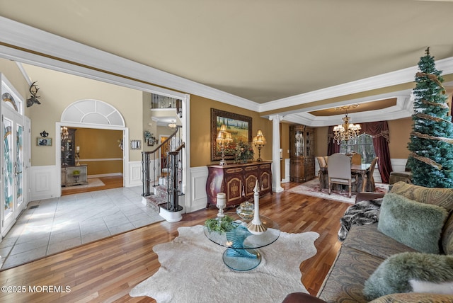 12 Conor Rd, Jackson, NJ 08527 - living room featuring stairs, decorative columns, ornamental molding, a chandelier, and wainscoting