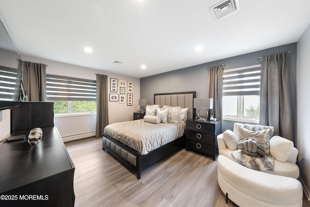 9 Crossridge Cir, Marlboro, NJ 07746 - bedroom with light wood-style flooring, a baseboard radiator, and recessed lighting