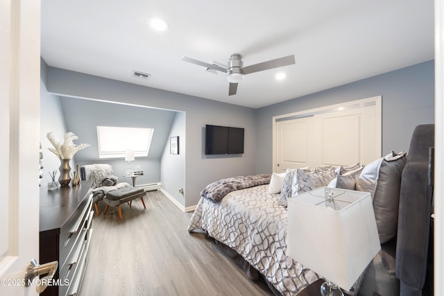 9 Crossridge Cir, Marlboro, NJ 07746 - bedroom featuring wood finished floors, baseboards, a skylight, recessed lighting, and a closet
