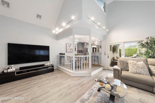9 Crossridge Cir, Marlboro, NJ 07746 - living area featuring high vaulted ceiling, wood finished floors, ceiling fan, and baseboards