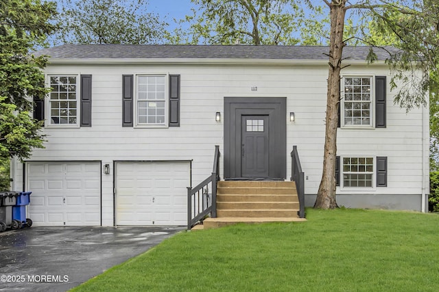 1117 Wake Forest Dr, Toms River, NJ 08753 - view of front of home with a garage, driveway, a front yard, and entry steps