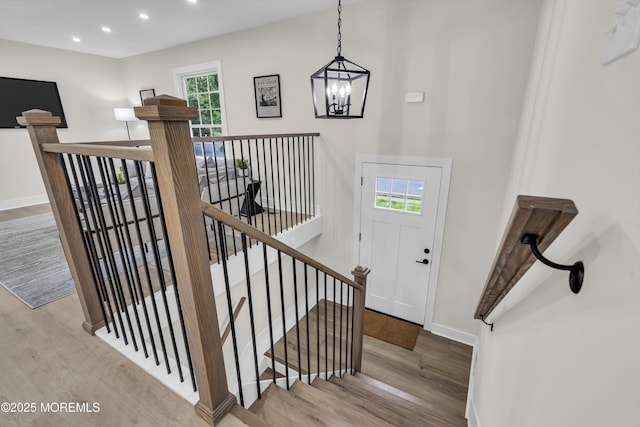 1117 Wake Forest Dr, Toms River, NJ 08753 - stairs with wood finished floors, a chandelier, baseboards, and recessed lighting