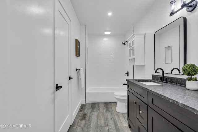1117 Wake Forest Dr, Toms River, NJ 08753 - bathroom featuring vanity, toilet, wood finished floors, bathtub / shower combination, and recessed lighting