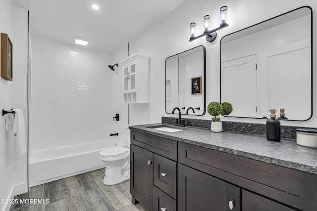 1117 Wake Forest Dr, Toms River, NJ 08753 - full bathroom featuring wood finished floors, vanity, toilet, and shower / washtub combination