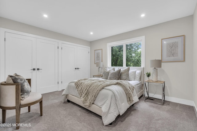 1117 Wake Forest Dr, Toms River, NJ 08753 - bedroom featuring multiple closets, light colored carpet, recessed lighting, and baseboards