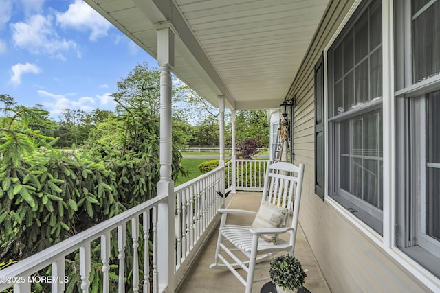 1 River Dr, Farmingdale, NJ 07727 - porch featuring view of wooded area