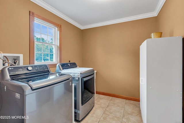 1 River Dr, Farmingdale, NJ 07727 - laundry room featuring washing machine and dryer, crown molding, and baseboards