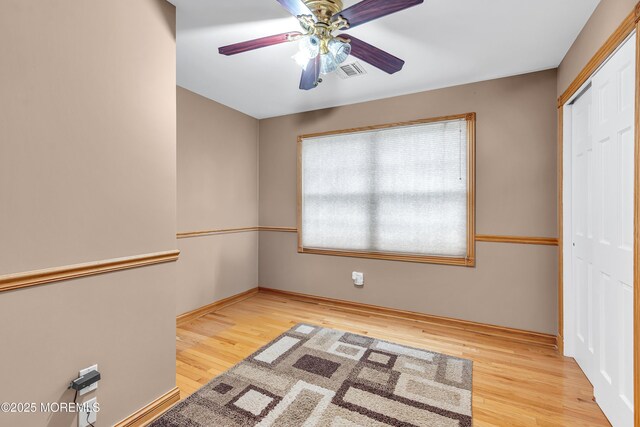 1 River Dr, Farmingdale, NJ 07727 - unfurnished bedroom featuring wood finished floors, a closet, and ceiling fan