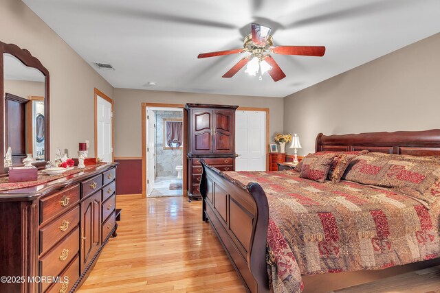 1 River Dr, Farmingdale, NJ 07727 - bedroom featuring light wood-style flooring, connected bathroom, and a ceiling fan