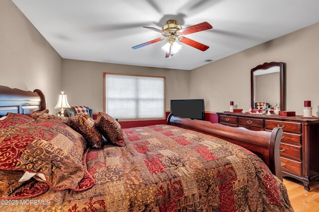 1 River Dr, Farmingdale, NJ 07727 - bedroom with light wood-type flooring and a ceiling fan