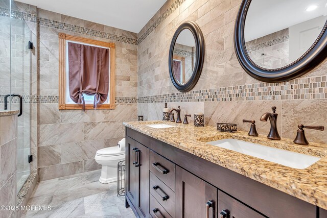 1 River Dr, Farmingdale, NJ 07727 - full bathroom with tile walls, double vanity, a shower stall, and toilet