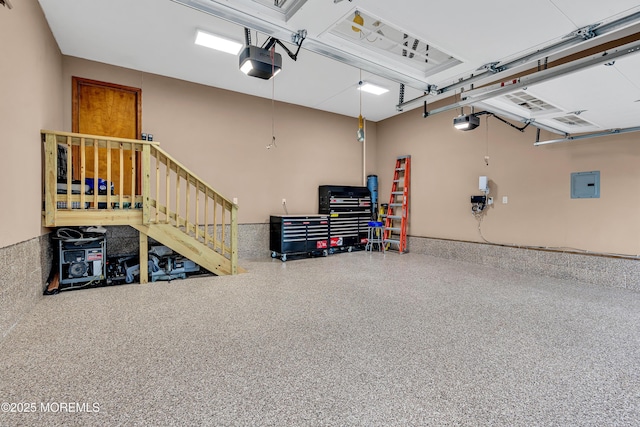 1 River Dr, Farmingdale, NJ 07727 - garage featuring a garage door opener and electric panel