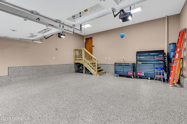1 River Dr, Farmingdale, NJ 07727 - garage featuring a garage door opener