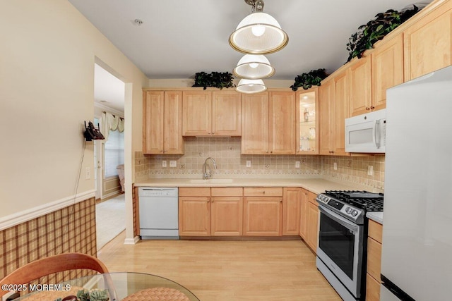 634 Saint Andrews Pl, Manalapan, NJ 07726 - kitchen featuring white appliances, light brown cabinetry, a sink, and light countertops