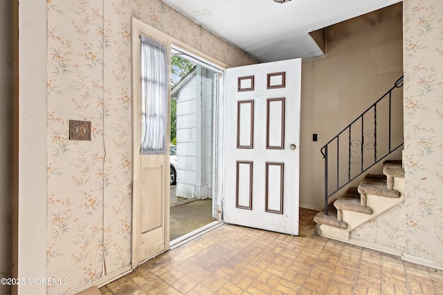 1233 Herkimer Rd, Brick, NJ 08724 - foyer entrance featuring stairs, wallpapered walls, baseboards, and brick patterned flooring