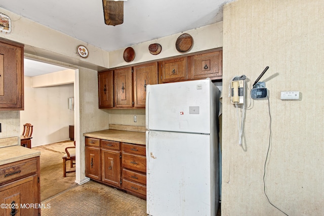 1233 Herkimer Rd, Brick, NJ 08724 - kitchen featuring freestanding refrigerator, brown cabinetry, and light countertops