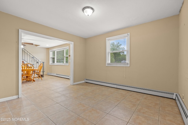 30 Woodland Dr, Howell, NJ 07731 - unfurnished room with plenty of natural light, a baseboard radiator, and stairway