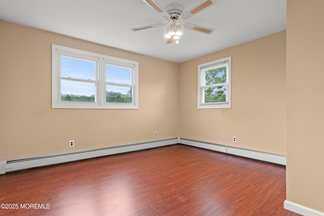 30 Woodland Dr, Howell, NJ 07731 - empty room featuring wood finished floors, ceiling fan, a baseboard radiator, and baseboards