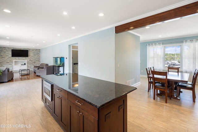 22 Corrigan Ave, Pine Beach, NJ 08741 - kitchen featuring crown molding, a center island, stainless steel microwave, recessed lighting, and baseboards