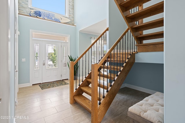 22 Corrigan Ave, Pine Beach, NJ 08741 - tiled entrance foyer with plenty of natural light, a towering ceiling, stairs, and baseboards