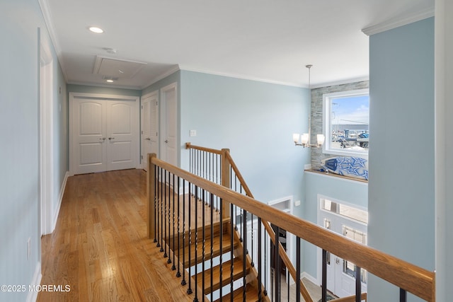 22 Corrigan Ave, Pine Beach, NJ 08741 - hall with an upstairs landing, attic access, light wood-style floors, crown molding, and baseboards