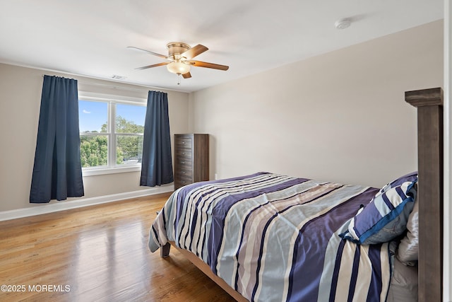 22 Corrigan Ave, Pine Beach, NJ 08741 - bedroom featuring baseboards, wood finished floors, and ceiling fan
