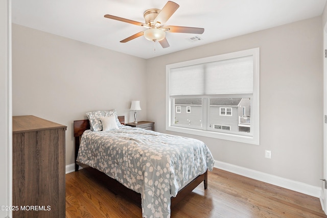 22 Corrigan Ave, Pine Beach, NJ 08741 - bedroom featuring baseboards, wood finished floors, and ceiling fan
