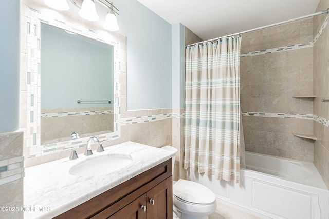 22 Corrigan Ave, Pine Beach, NJ 08741 - full bathroom with toilet, vanity, shower / bathtub combination with curtain, tile walls, and wainscoting