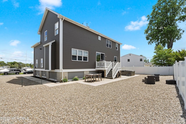 22 Corrigan Ave, Pine Beach, NJ 08741 - rear view of house featuring a hot tub, a patio, and a wooden deck