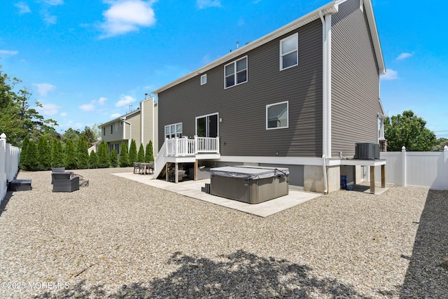 22 Corrigan Ave, Pine Beach, NJ 08741 - back of house with a hot tub, a fenced backyard, a patio, a deck, and cooling unit