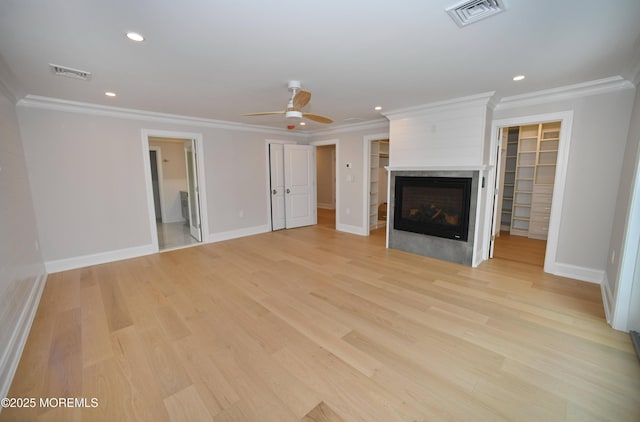 674 Lake Ave, Bay Head, NJ 08742 - unfurnished living room featuring crown molding, a multi sided fireplace, a ceiling fan, baseboards, and light wood-style flooring