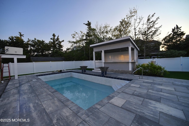674 Lake Ave, Bay Head, NJ 08742 - pool at dusk featuring a patio and a fenced backyard