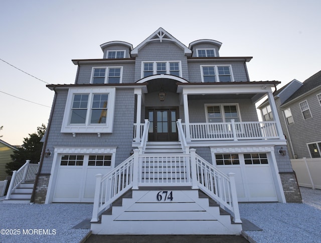 674 Lake Ave, Bay Head, NJ 08742 - view of front of property featuring stairs, a garage, covered porch, and gravel driveway