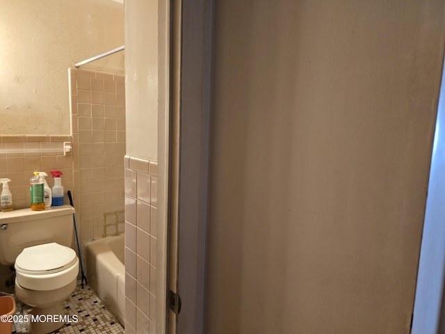 6 Conestoga Dr Unit A, Whiting, NJ 08759 - bathroom with tile walls, toilet, tile patterned floors, wainscoting, and shower / tub combination