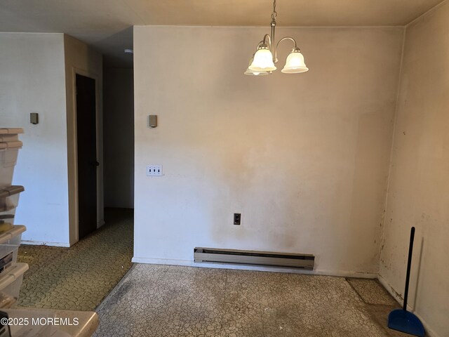 6 Conestoga Dr Unit A, Whiting, NJ 08759 - spare room featuring a baseboard radiator and a chandelier