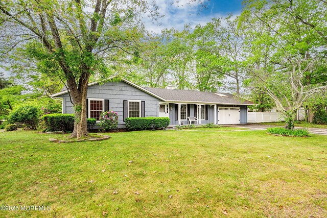 1015 Barnacle Dr, Manahawkin, NJ 08050 - single story home with an attached garage, covered porch, driveway, and a chimney