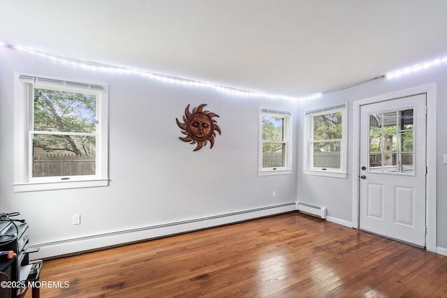 1015 Barnacle Dr, Manahawkin, NJ 08050 - entrance foyer featuring wood finished floors and a baseboard heating unit